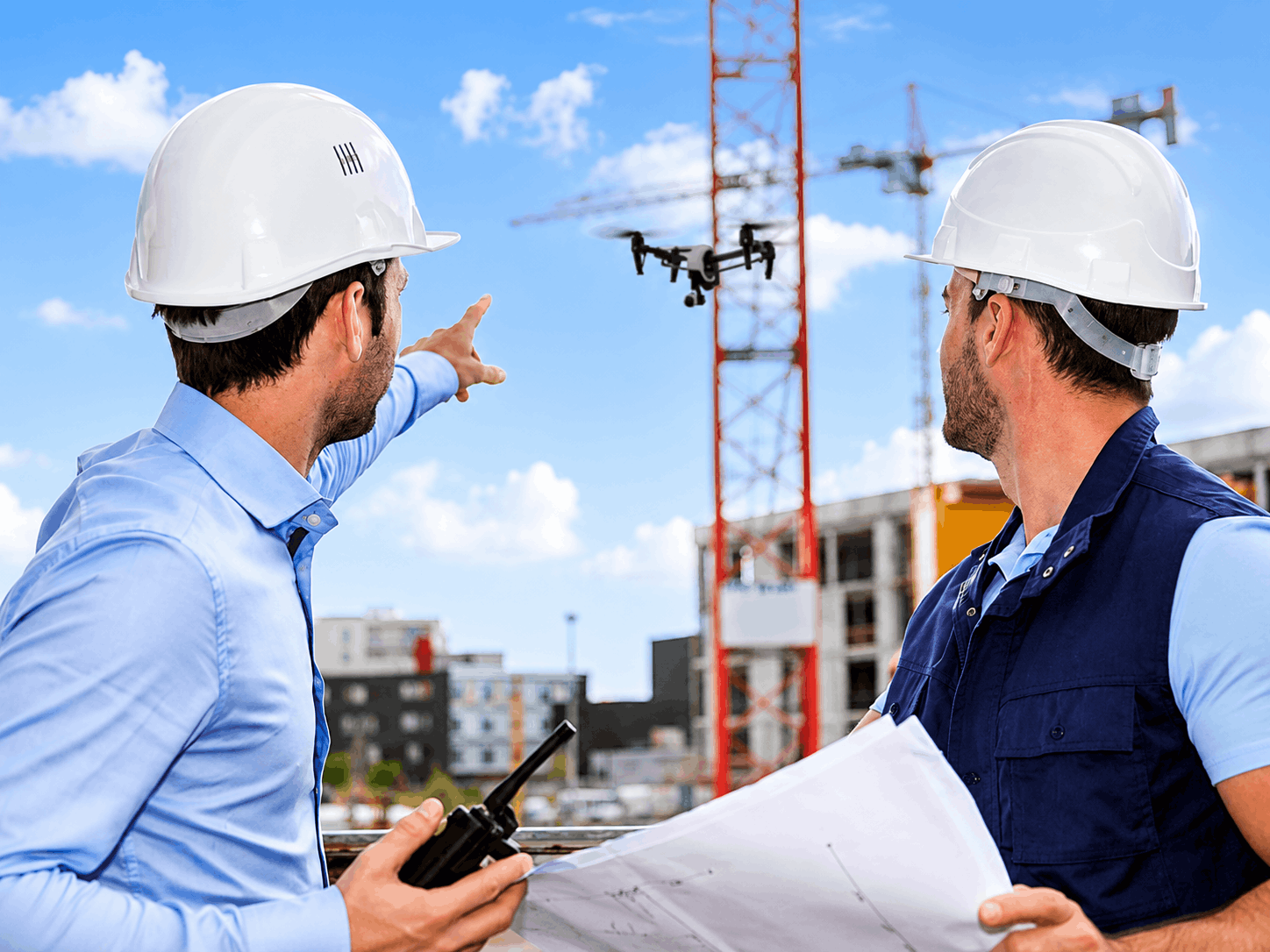 Construction professionals reviewing live site work